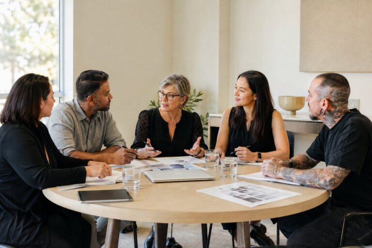 Government, public health, consumer and body art representatives discussing draft safety standards around a shared table