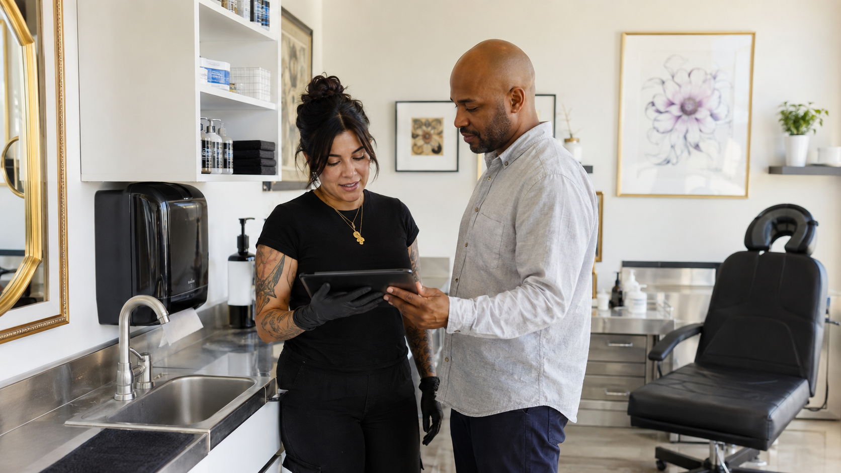 Reviewer and body art artist checking that a studio improvement works